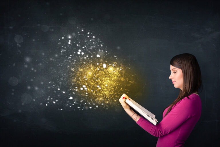 Young lady reading a magical book