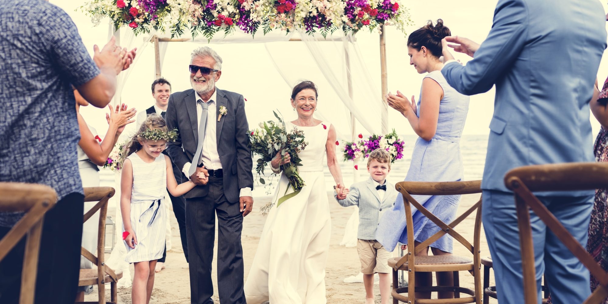 Senior couple getting married at the beach