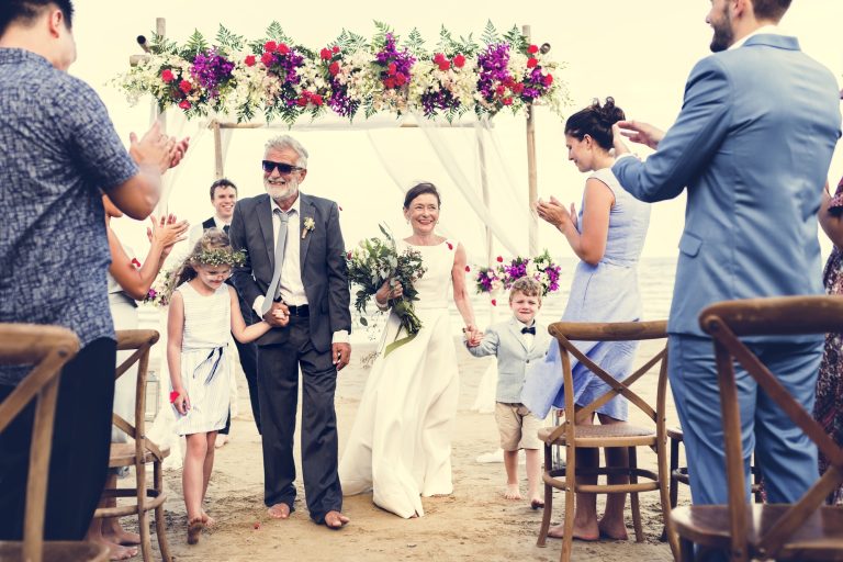 Senior couple getting married at the beach