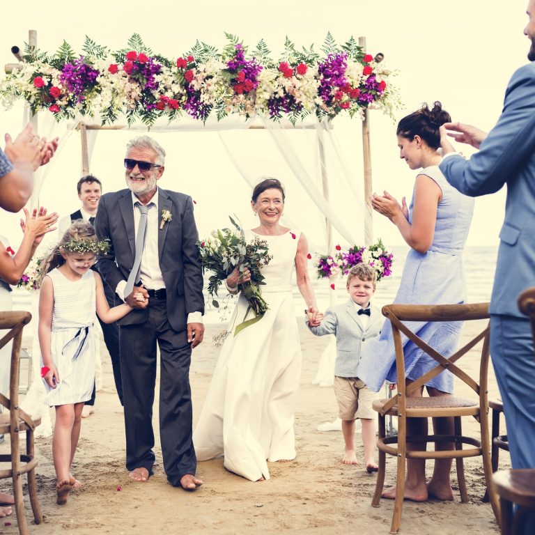Senior couple getting married at the beach