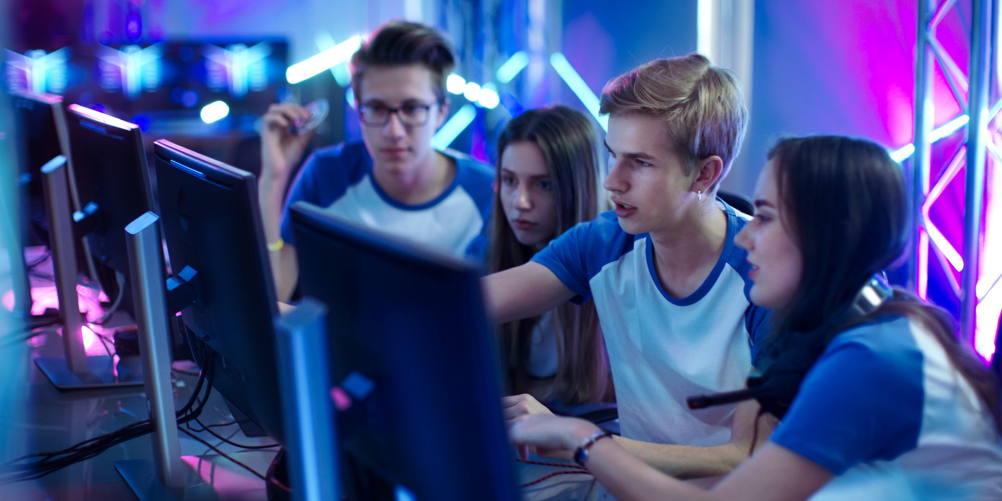 Team of Professional Boys and Girls Gamers Actively Thinking/ Di