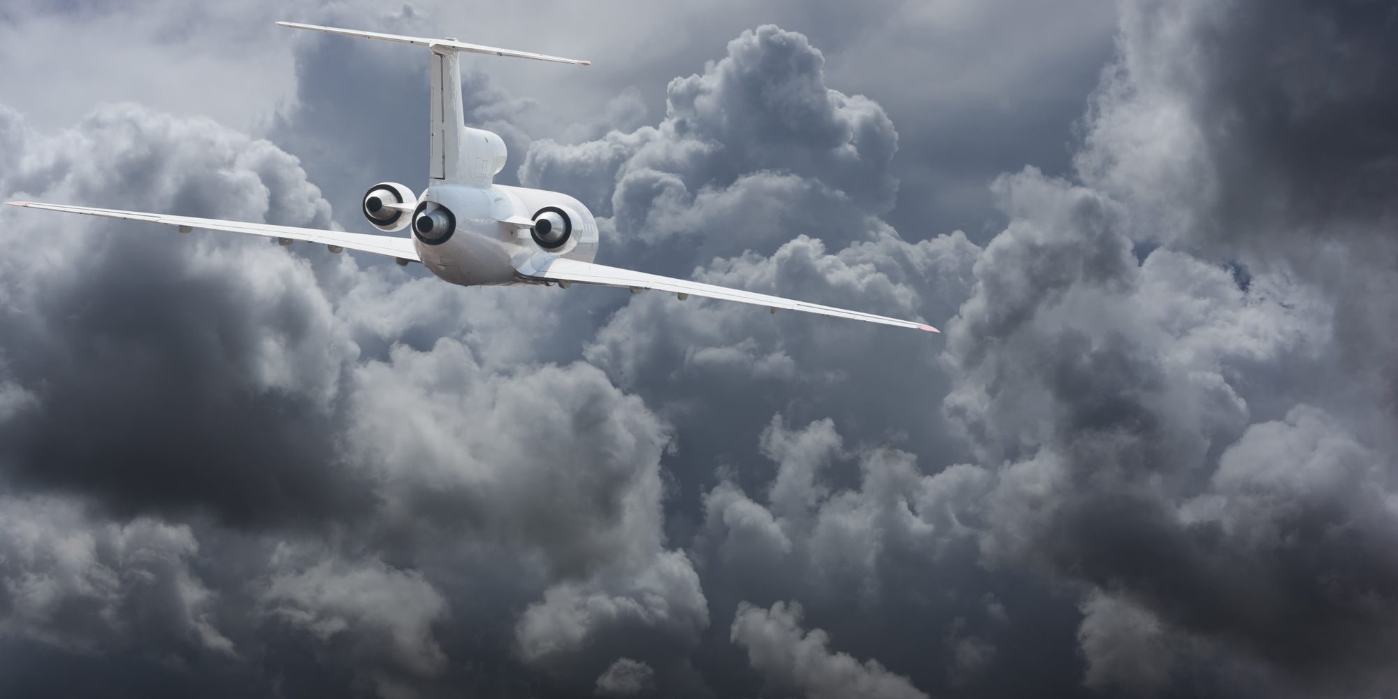 Civil airliner head to thunderstorm clouds