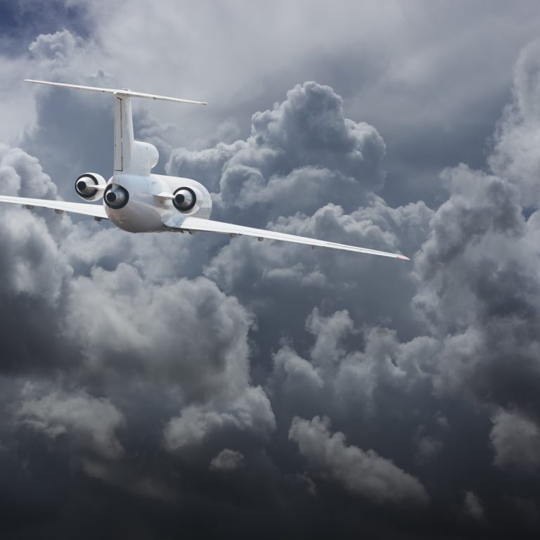 Civil airliner head to thunderstorm clouds